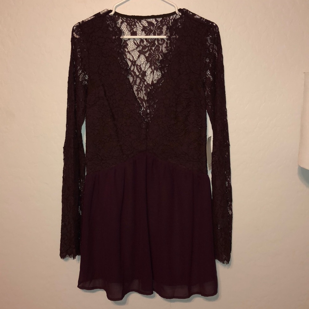 Beautiful wine colored lace, winged sleeve dress.